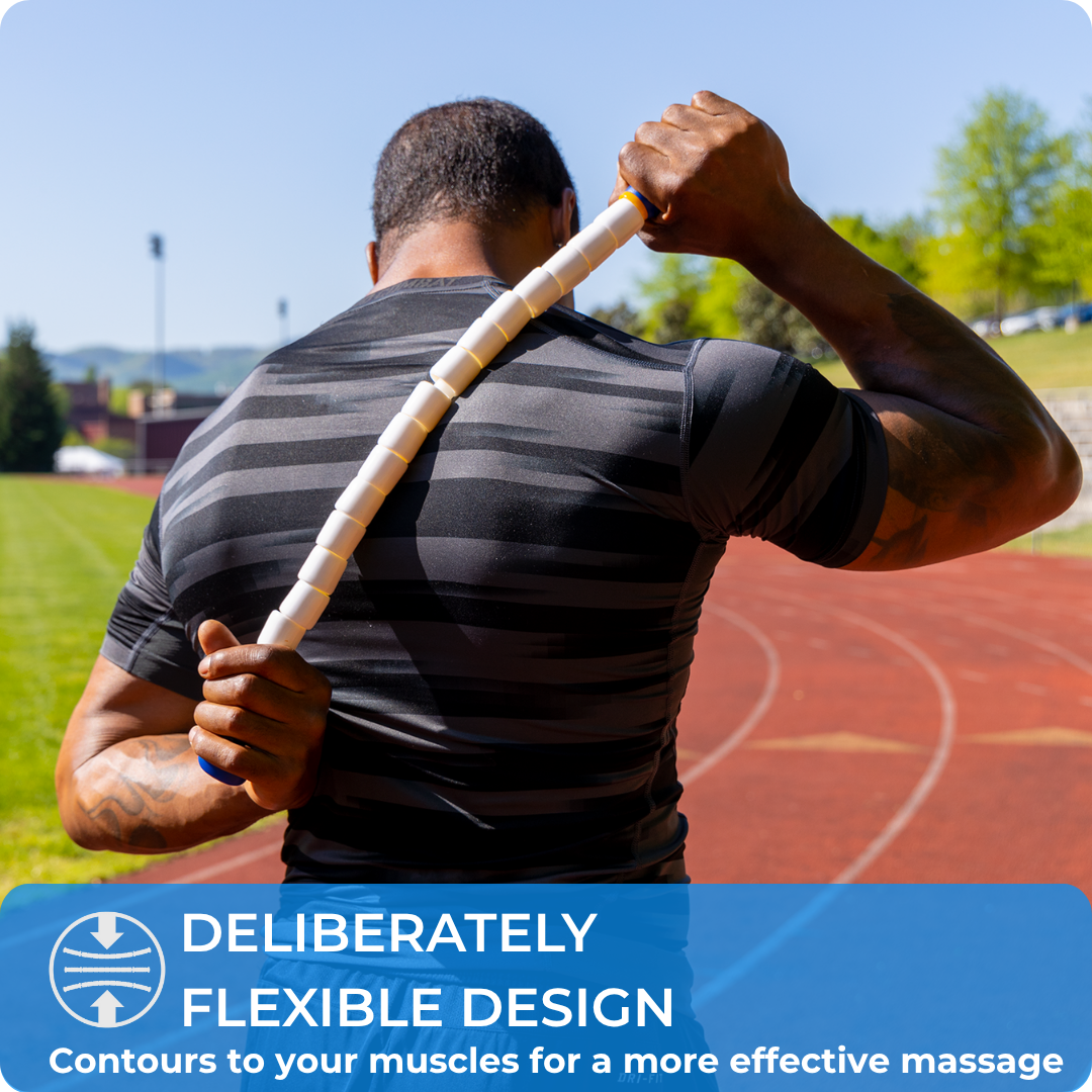 A person uses the Body Stick- 24 on their upper back while standing on a running track. Text reads: Flexible design contours to your muscles for a more effective back massage.