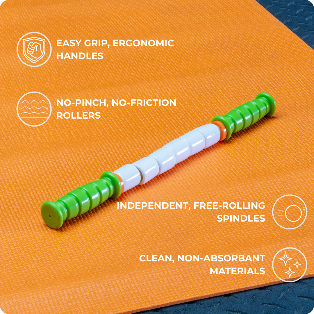 The Little Stick-14, a green and white portable massage stick with ergonomic handles and segmented rollers, rests on an orange mat. Its easy grip, non-absorbent materials, and trigger point relief help promote effective muscle recovery.