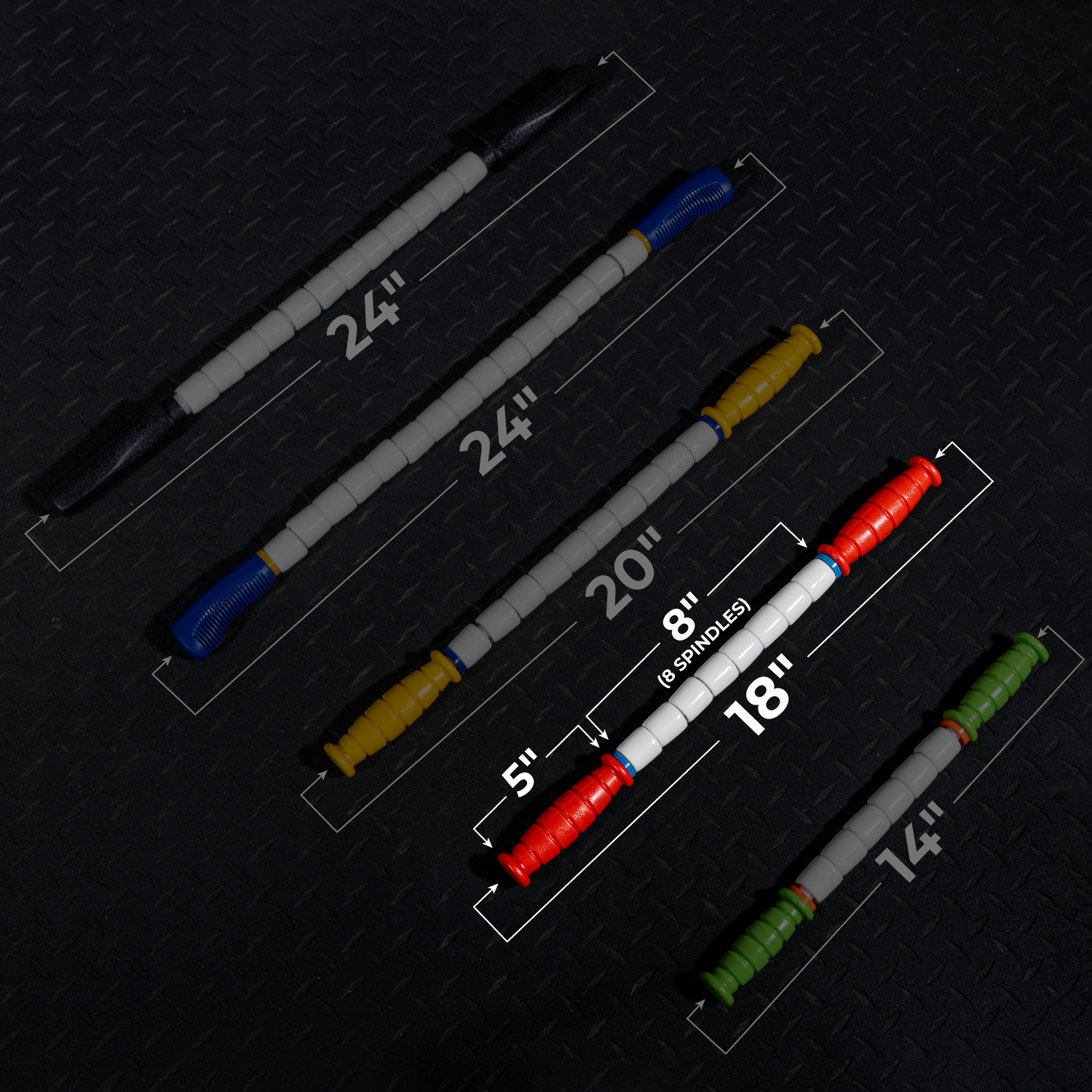 An 18 Travel Stick with colored handles and white rollers, labeled with its measurement, is diagonally arranged on a dark textured floor—perfect for quick muscle recovery and an essential addition to your gym bag.