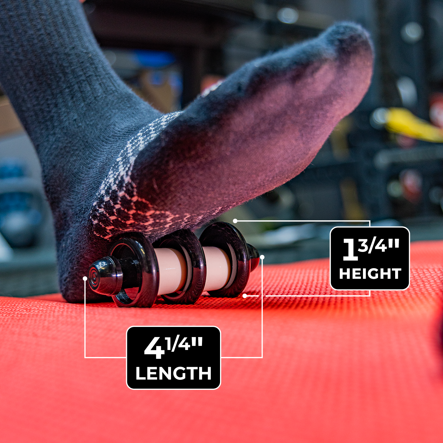 Close up photo of the Foot Roller in use, with these size specifications highlighted. 1.75" height and 4.25" length.